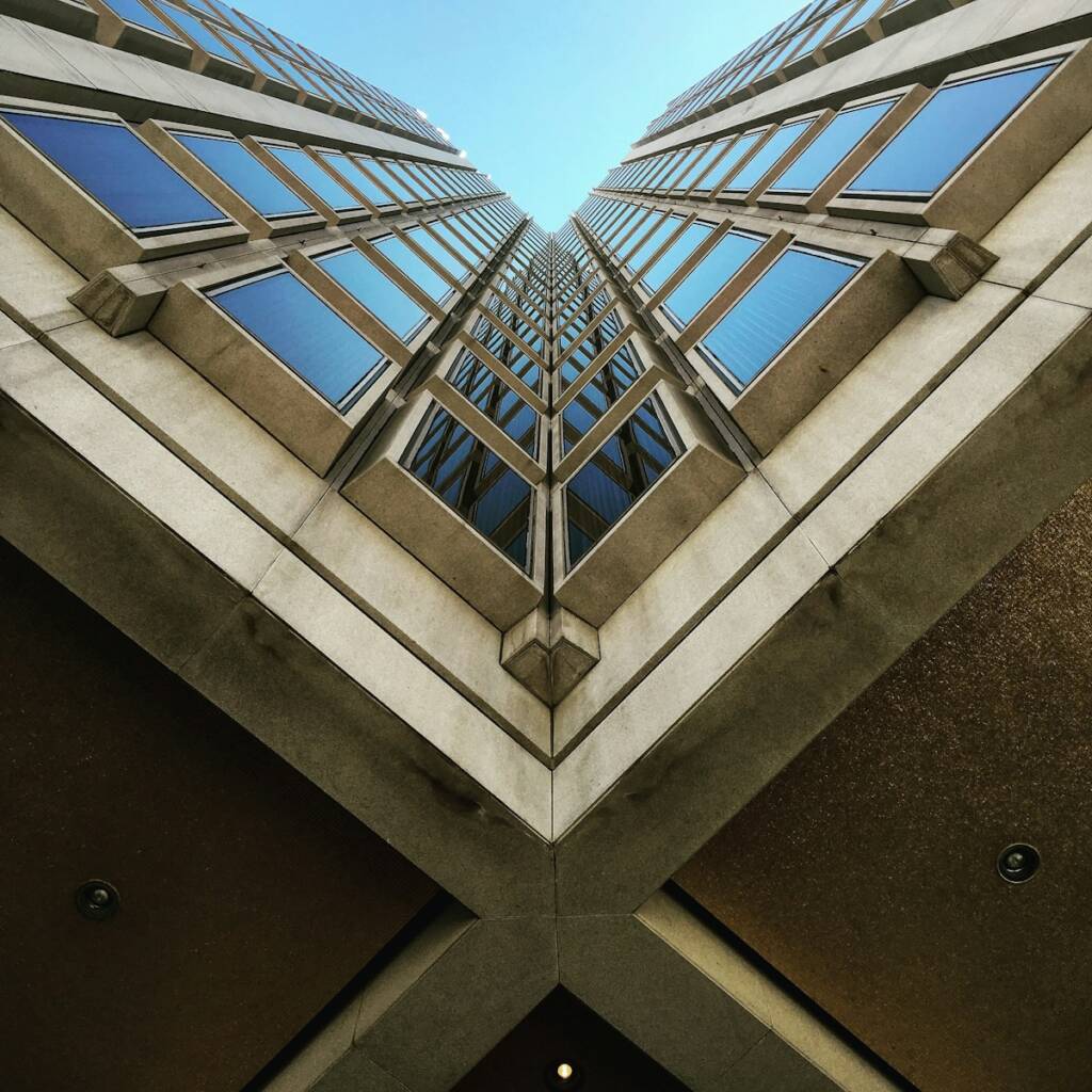 Photo by John Macdonald low angle view photography of brown high rise building